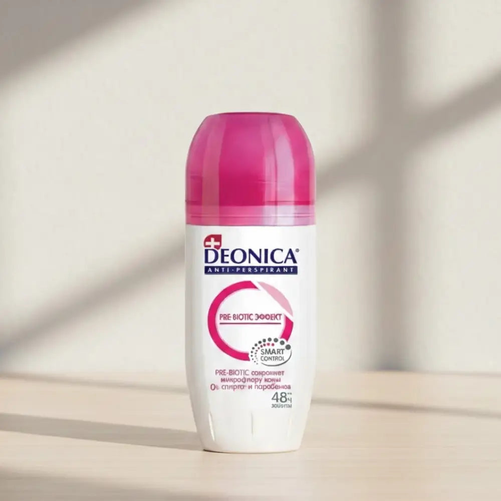 Deonica antiperspirant deodorant bottle with red cap on a white background