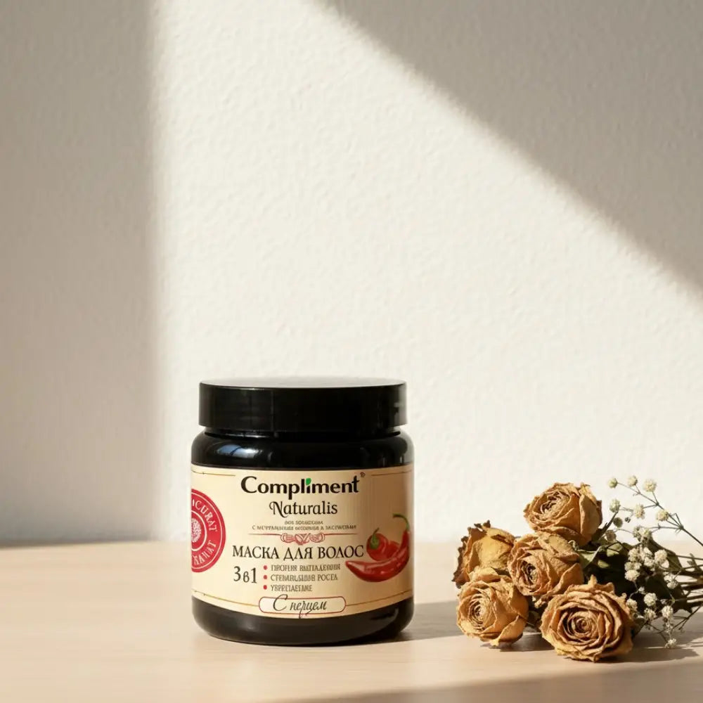 Jar of hair mask with black lid and visible branding on a white background