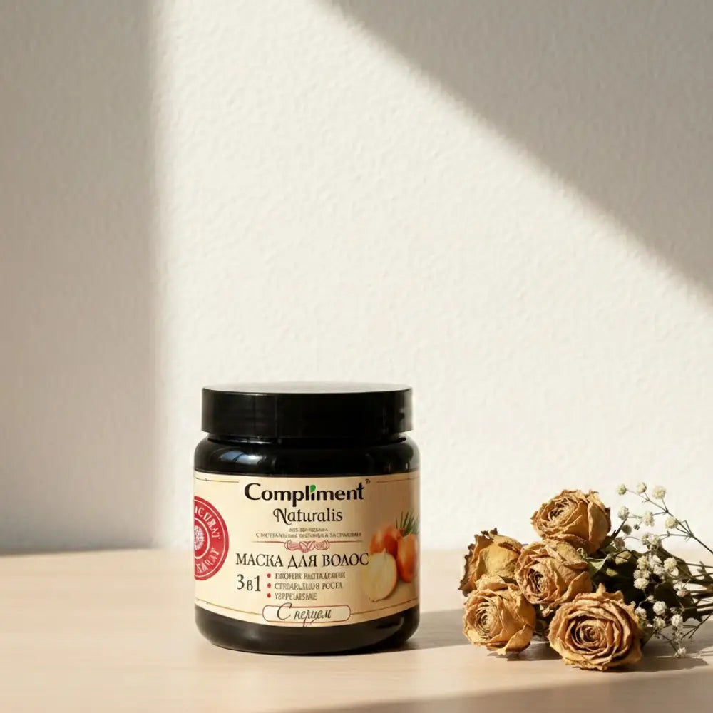 Jar of Compliment Naturalis hair mask with green label and black lid on white background
