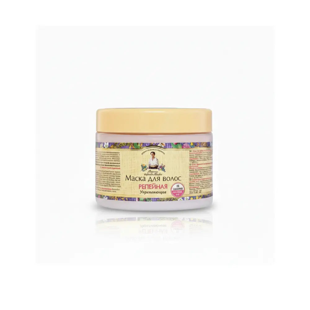 Jar of hair mask with a yellow lid and colorful label on a white background