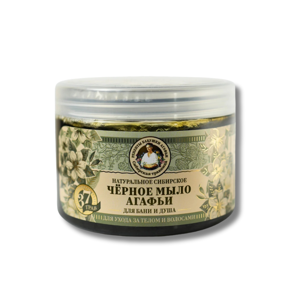Jar of natural Siberian black soap with a decorative label on a white background