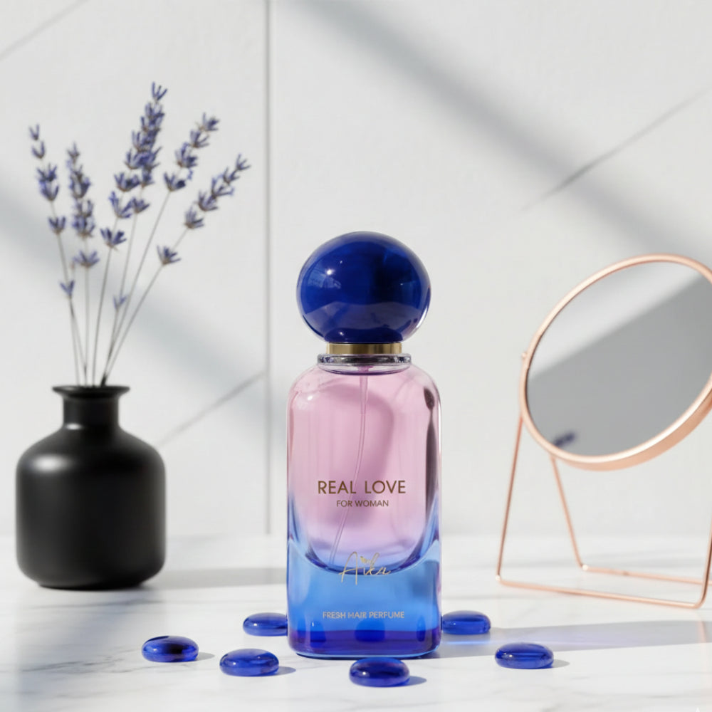 Perfume bottle labeled 'Real Love for Woman' with a blue and pink gradient on a white background