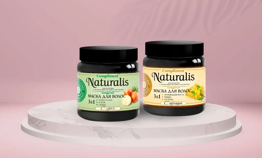 Two jars of Compliment Naturalis hair mask on a pink background