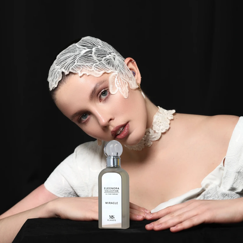 Elmays skincare product with a woman holding it near her face on a light background